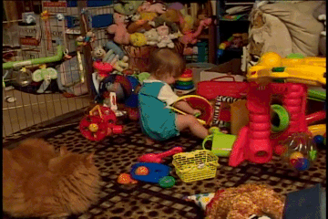 Willow as a baby playing with toys.